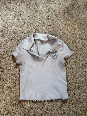 Light Blue Polo Top with Embroidered Crest
